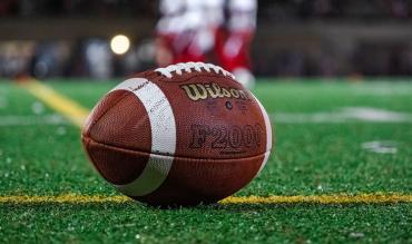 NFL quarterback waits for ball to be spiked